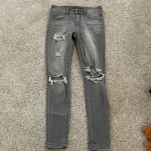 grey ripped anerican eagle jeans